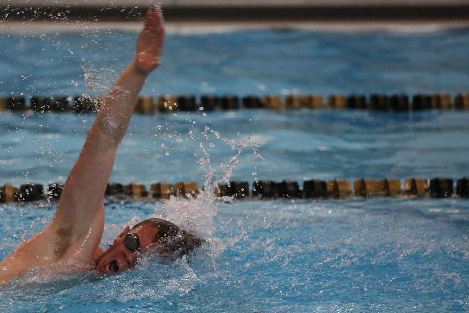 John Wonka takes a breath before pulling forward during the 50 yard freestyle